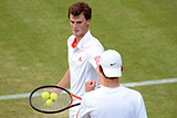 Jamie Murray and Eric Butorac high five eachother during their opening round doubles match.